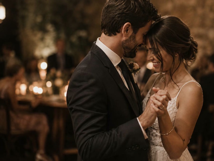 Bride and groom sharing a quiet first dance at their reception